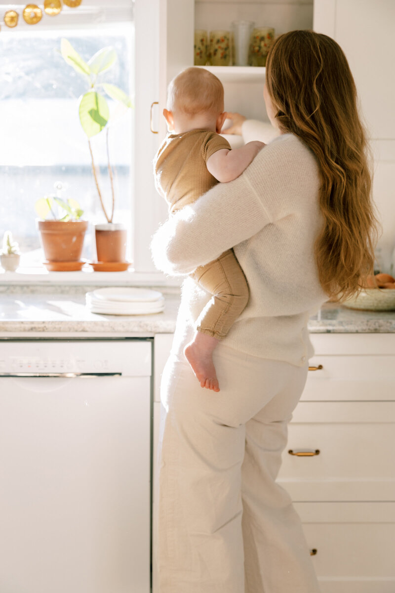 A T1D mom holding her child’s hand, symbolizing connection and support on the diabetes journey.