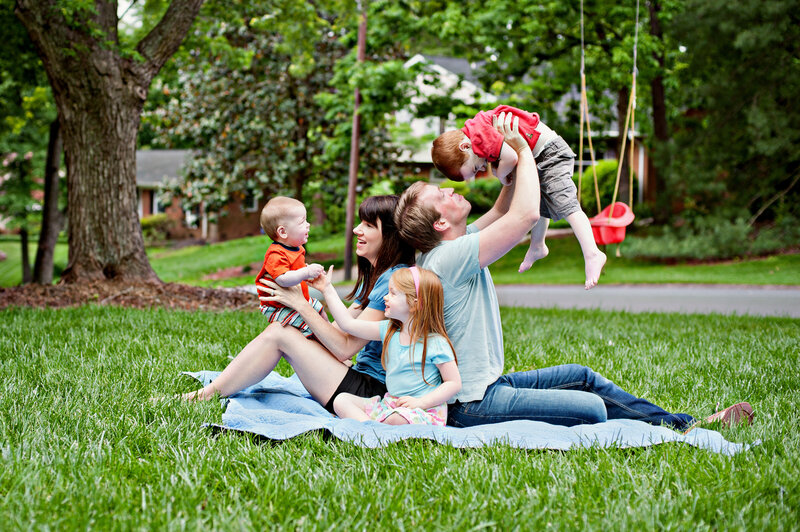 Photograph of family walking and being photographed by Tiona Fuller Family Photographer in Austin TX