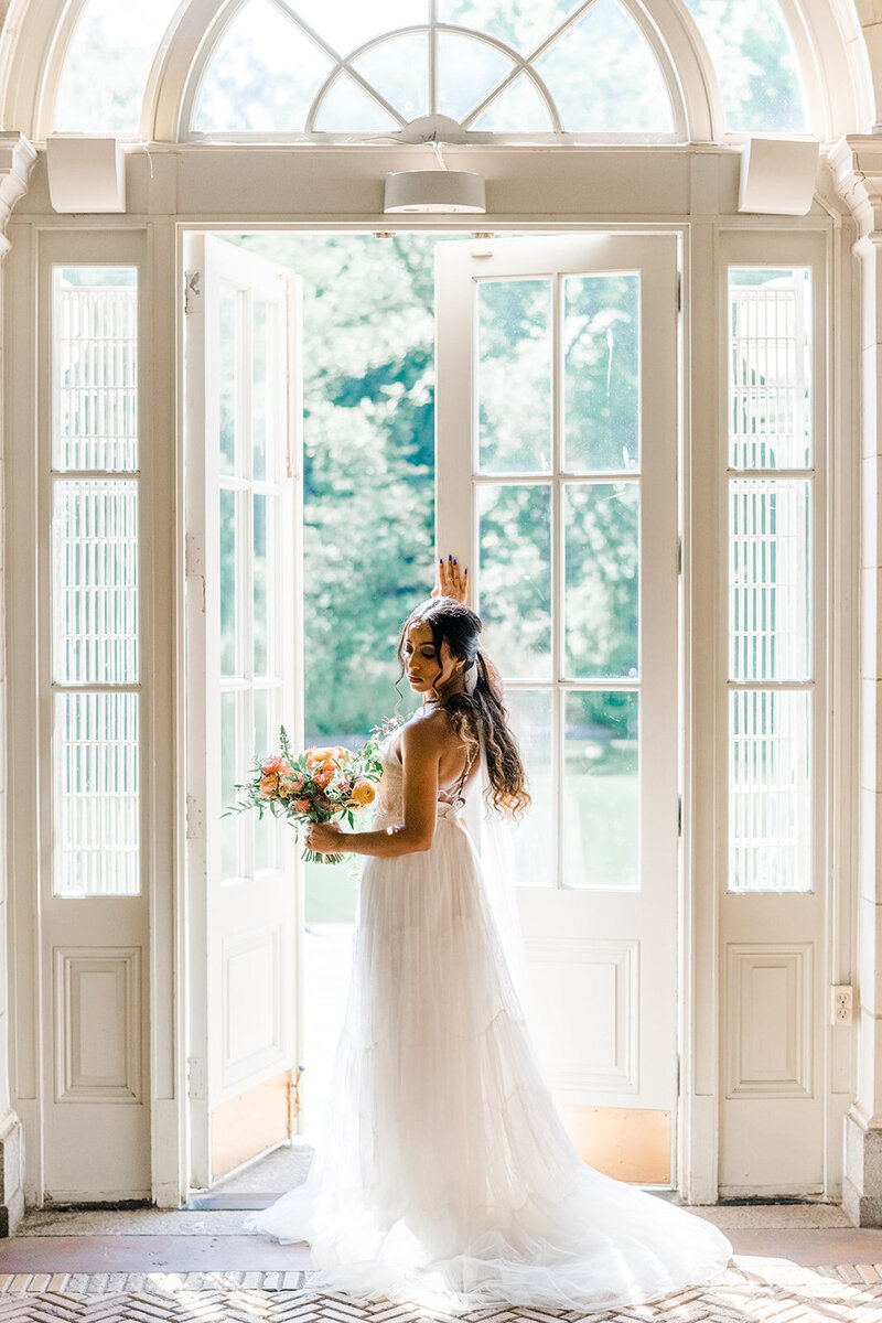 bride in front of large window