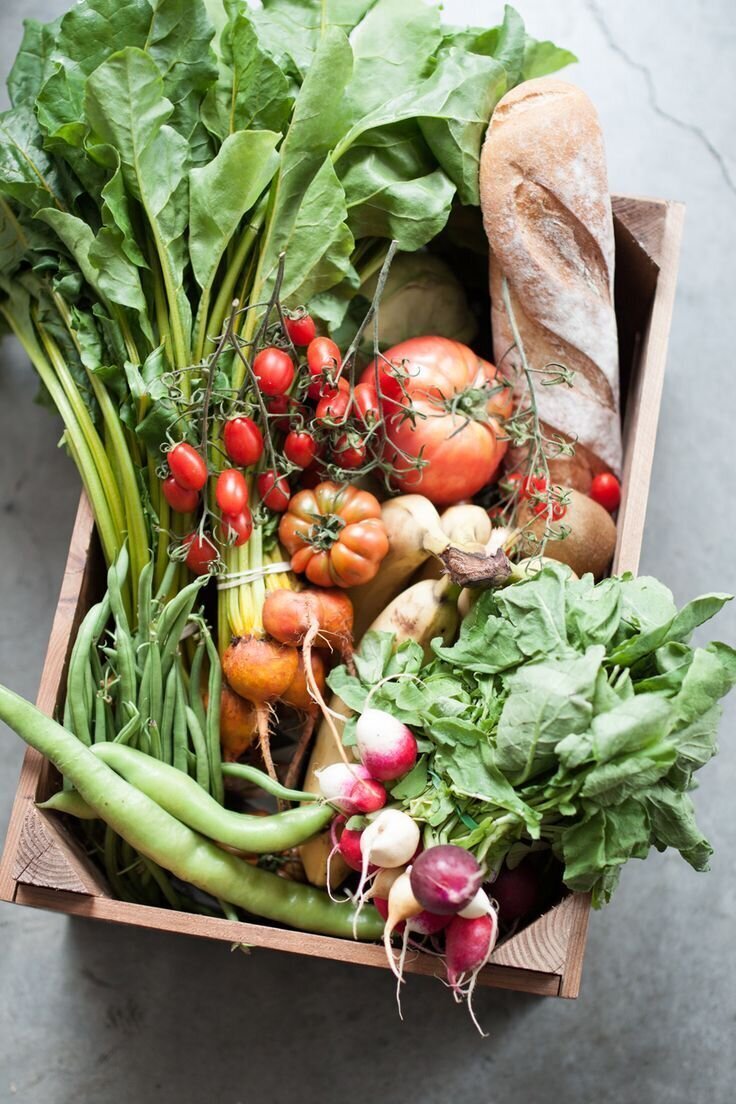 A wooden box overflowing with fresh vegetables, symbolizing Eating Disorder Recovery in Chicago.