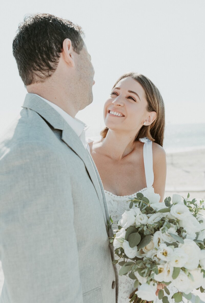 bride smiling at groom at wedding in Malibu