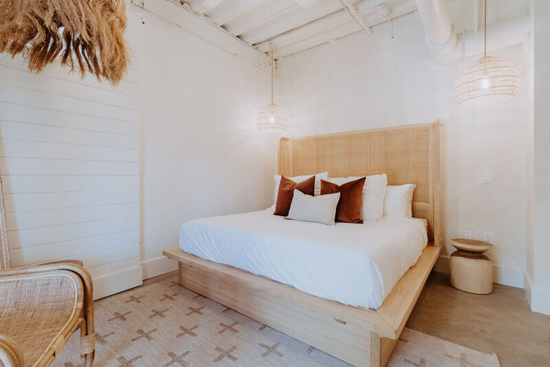 King bed with white linen and pillows