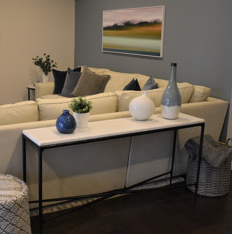 Vases and table behind sectional