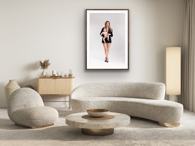 Earthy living room with a beautiful printed  motherhood portrait on the wall