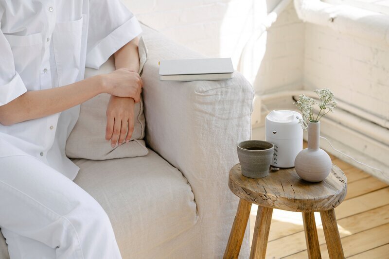 Young adult therapy Raleigh featuring woman on couch