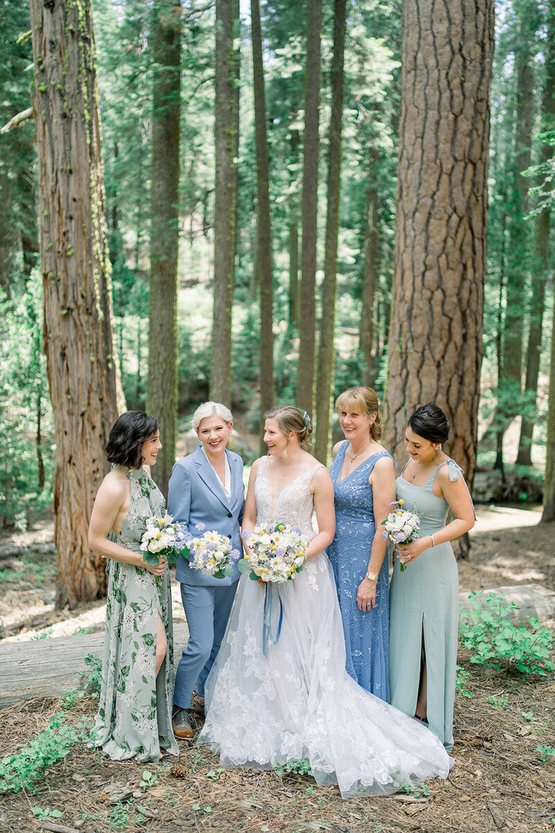 Tiffany Longeway Photography captures a beautiful bridal party moment amidst the towering trees at Nestldown in Los Gatos, California. The lush forest setting and the elegant attire of the bridal party create a perfect blend of natural beauty and sophistication, ideal for couples seeking a serene and picturesque venue for their wedding celebration.