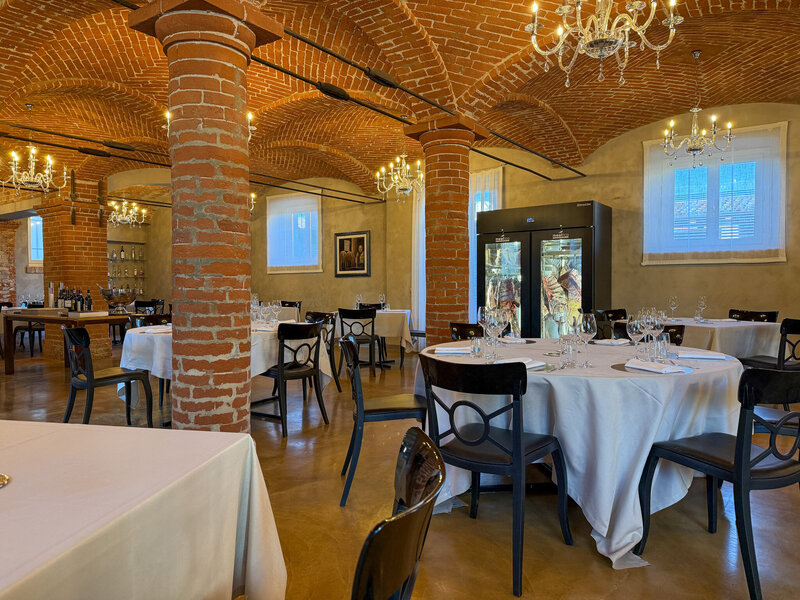 Indoor dining room at Scuderie Sabaude in Pollenzo, Italy