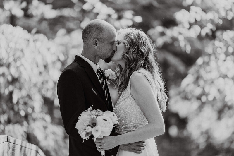 Couple kissing on their wedding day in Asheville, NC.