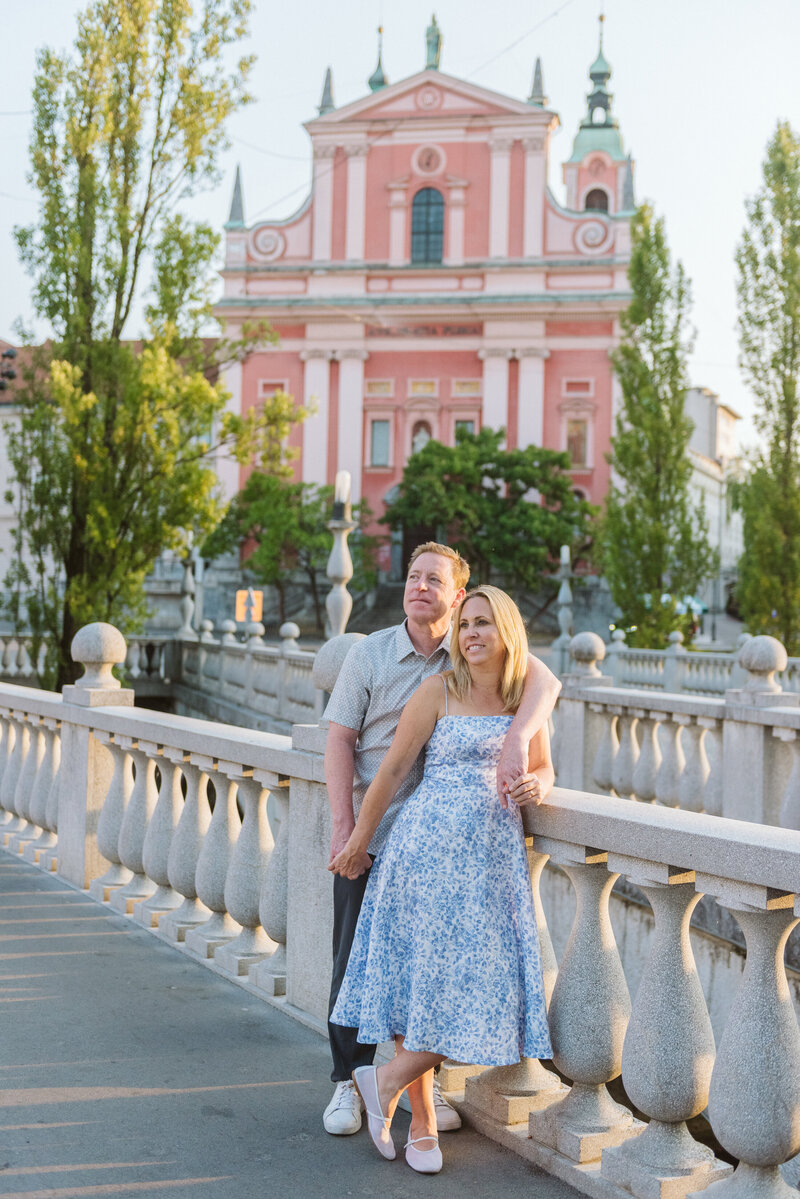 Ljubljana Slovenia Flytographer us looking at city with church behind us 