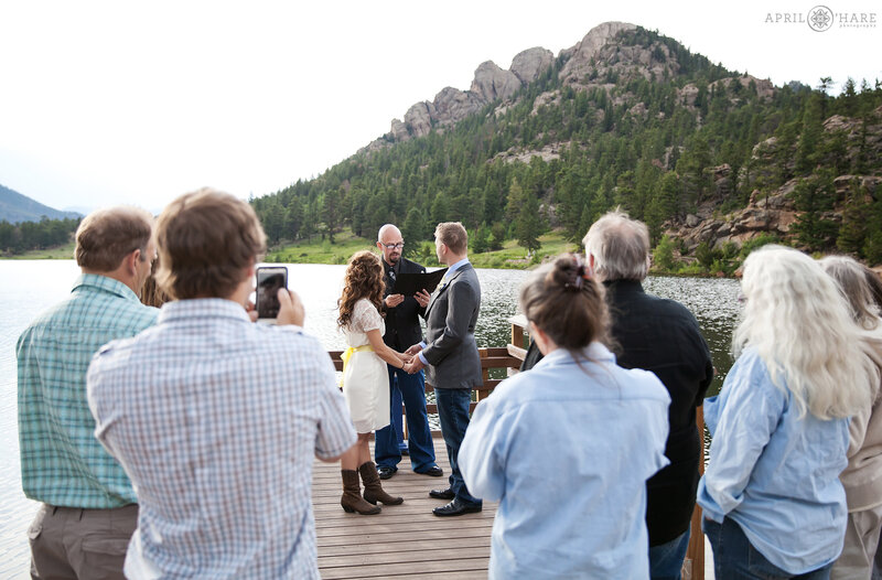 Couple wed on the Lily Lake Dock at Rocky Mountain National Park in Colorado