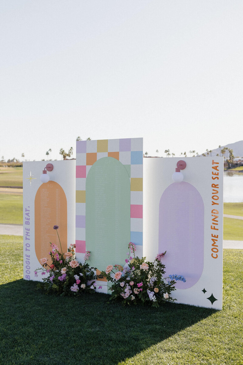Fun pastel-coloured custom wedding signage at Arizona wedding reception