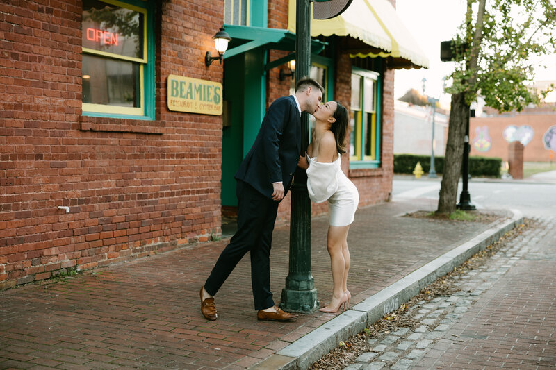 photo of engagement couple kissing in downtown Augusta, Georgia