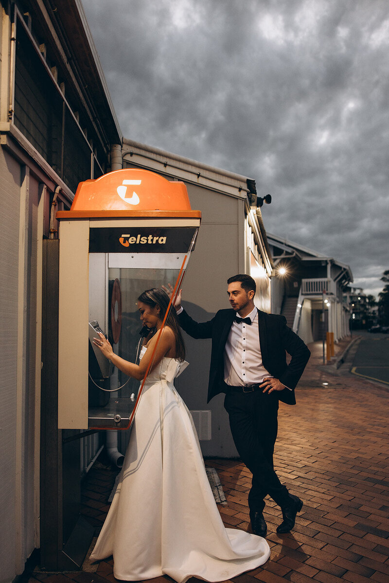 Vintage style images of bride and groom at a phone box, sunshine coast wedding photography