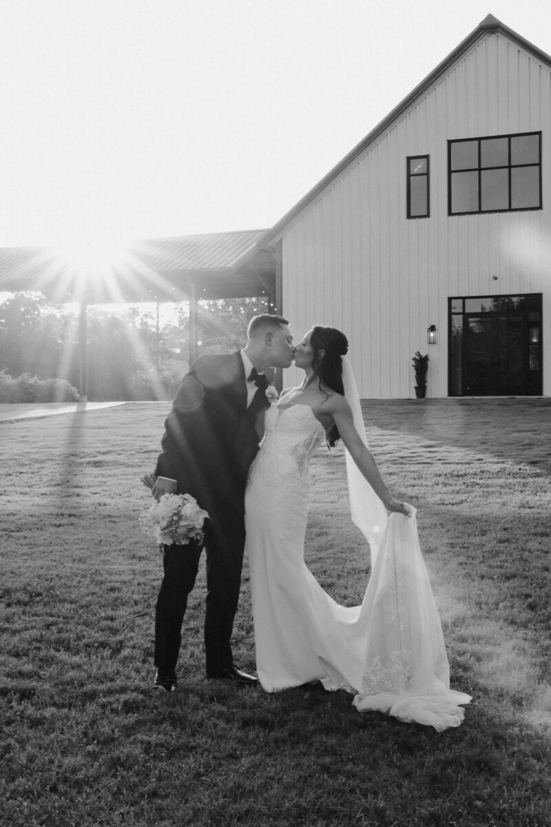 Bride and groom walking hand in hand at sunset — captured by Houston wedding photographers Julie & Daniel