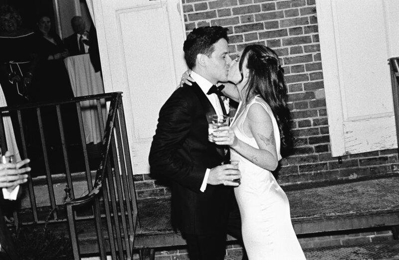 Blurry photo of bride and groom running inside at the end of the night at Glen Foerd Estate in Philadelphia, PA