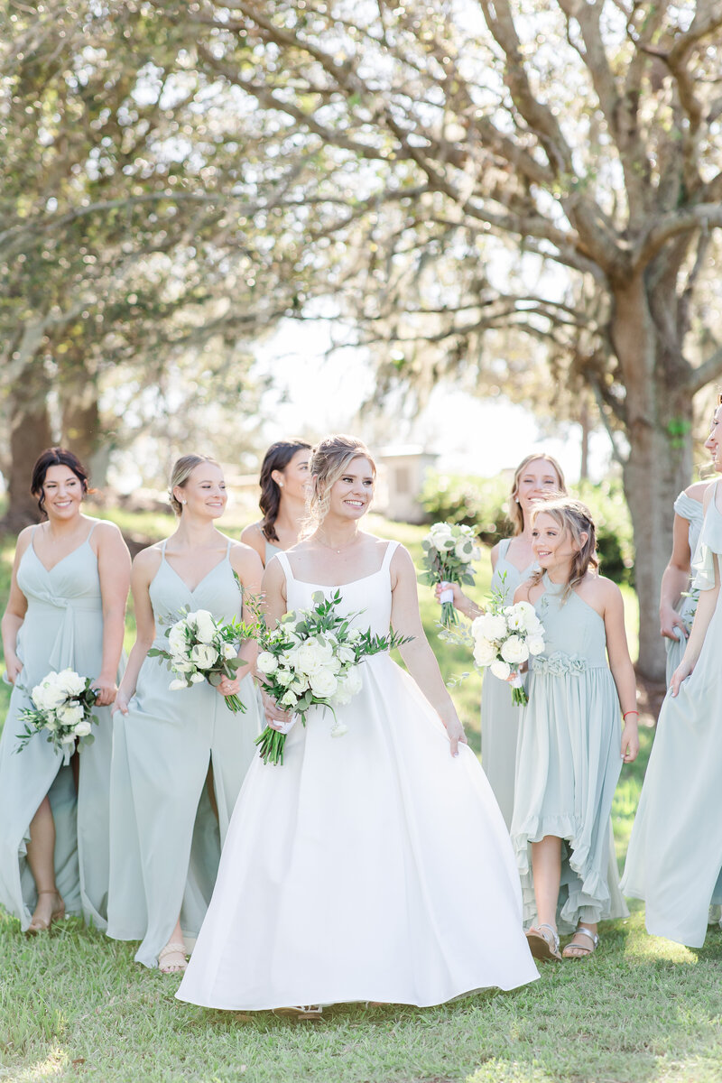 bride standing with bridesmaids