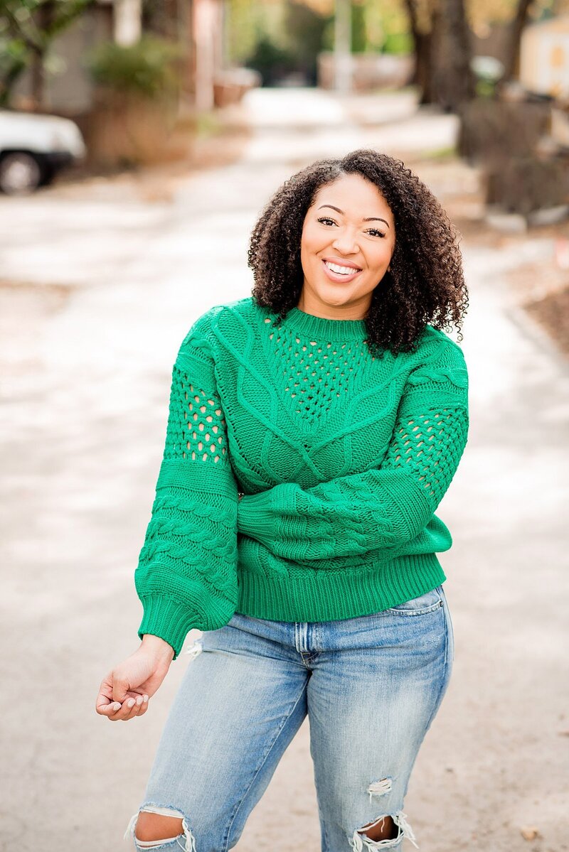 Jasmine Sweet wearing cute jeans and cable knit green sweater