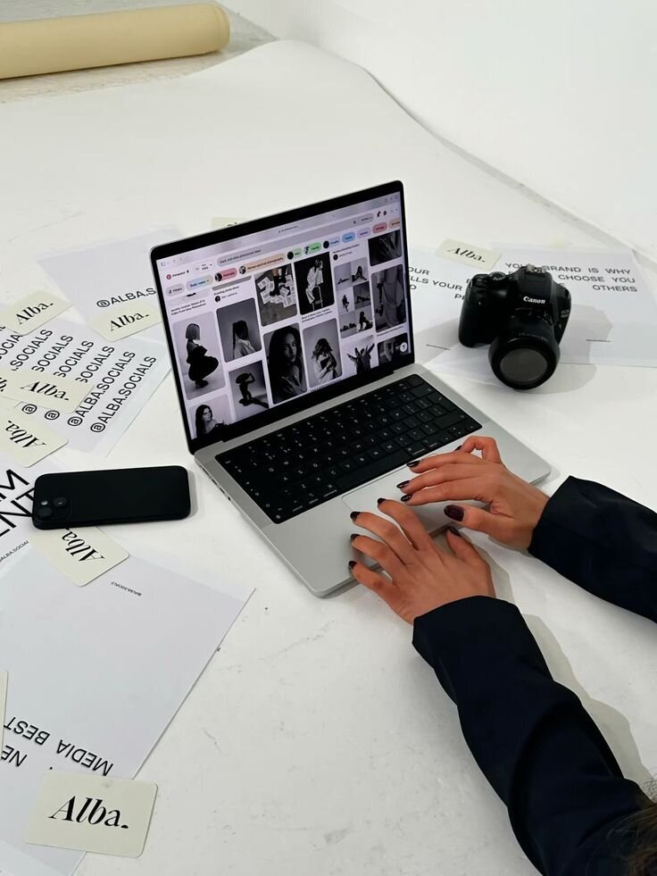 Business woman scrolling through pintrest on her MacBook Pro