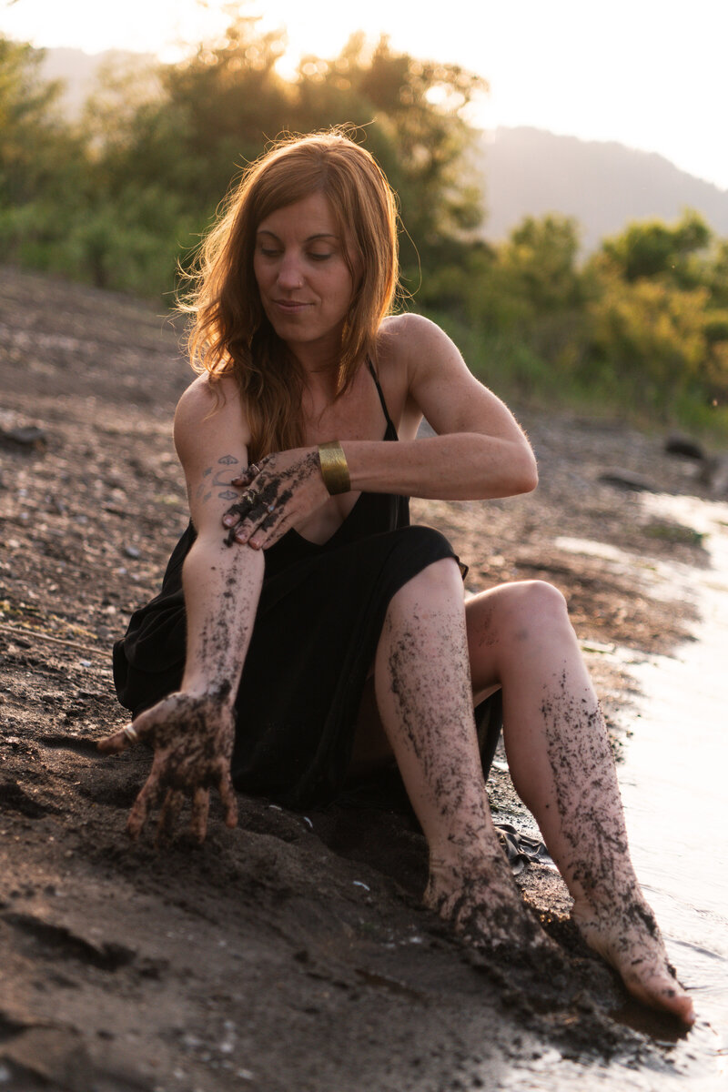 yoga teacher sitting at riverside
