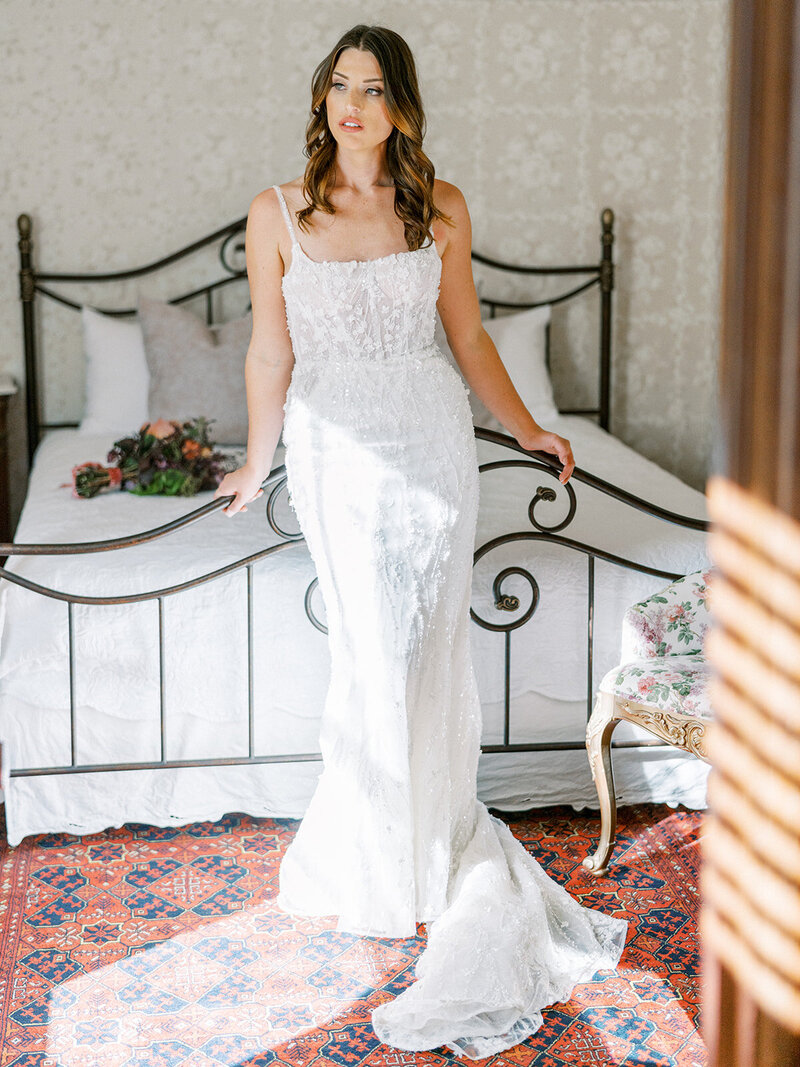 A french wedding day in Paso Robles with Bridgerton themed decor and lace linens, pink and white flowers and gorgeous themed plates.