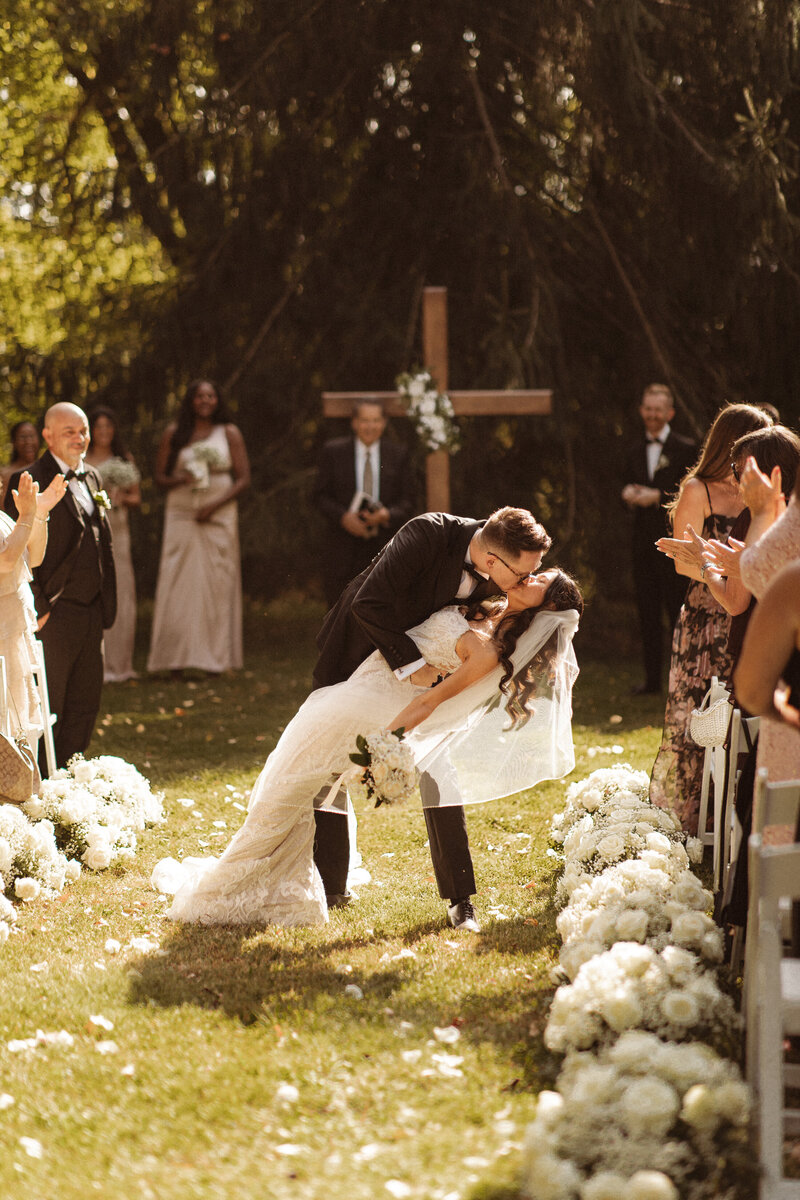 Bride and Groom taking intimate wedding photos  on the marina, taken by NJ micro wedding photographer