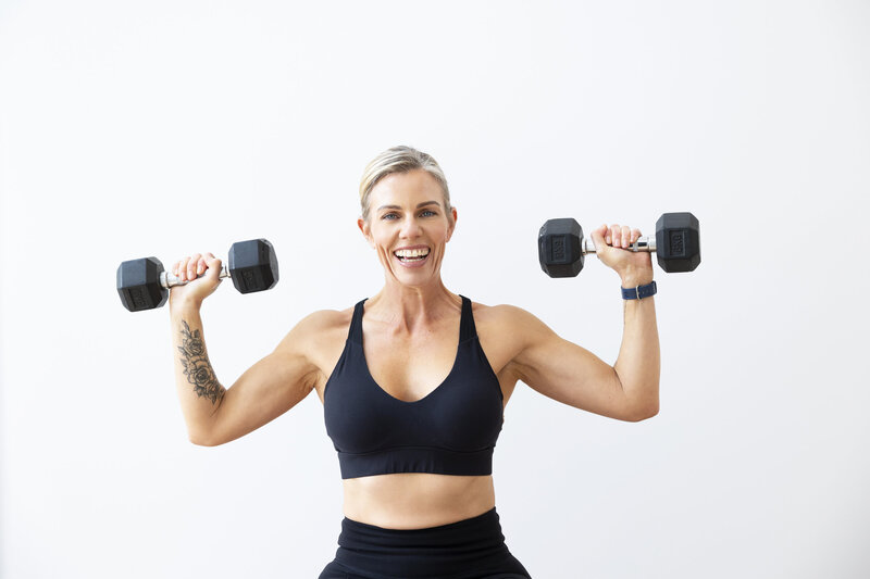 Katie Appleby demonstrating a fitness move, offering expert guidance on proper form and technique for optimal results.
