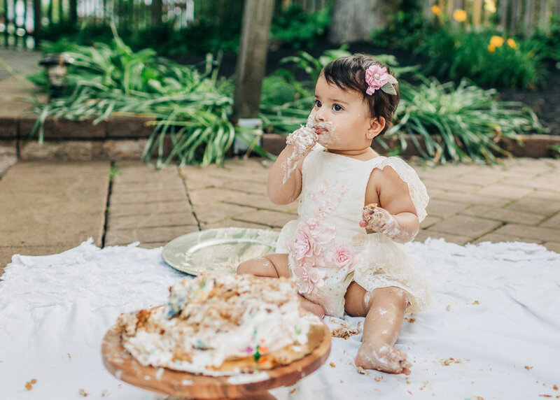 first birthday milestone photo featuring a cake smash