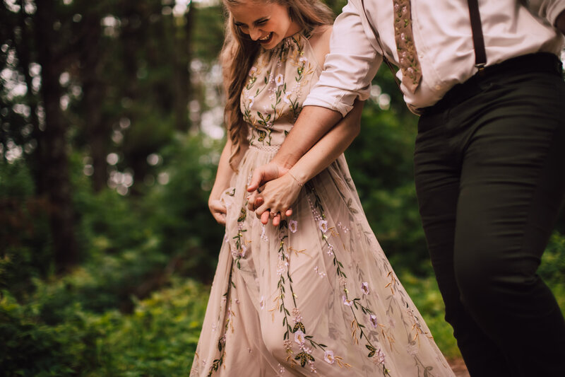 Bride and groom hold hands