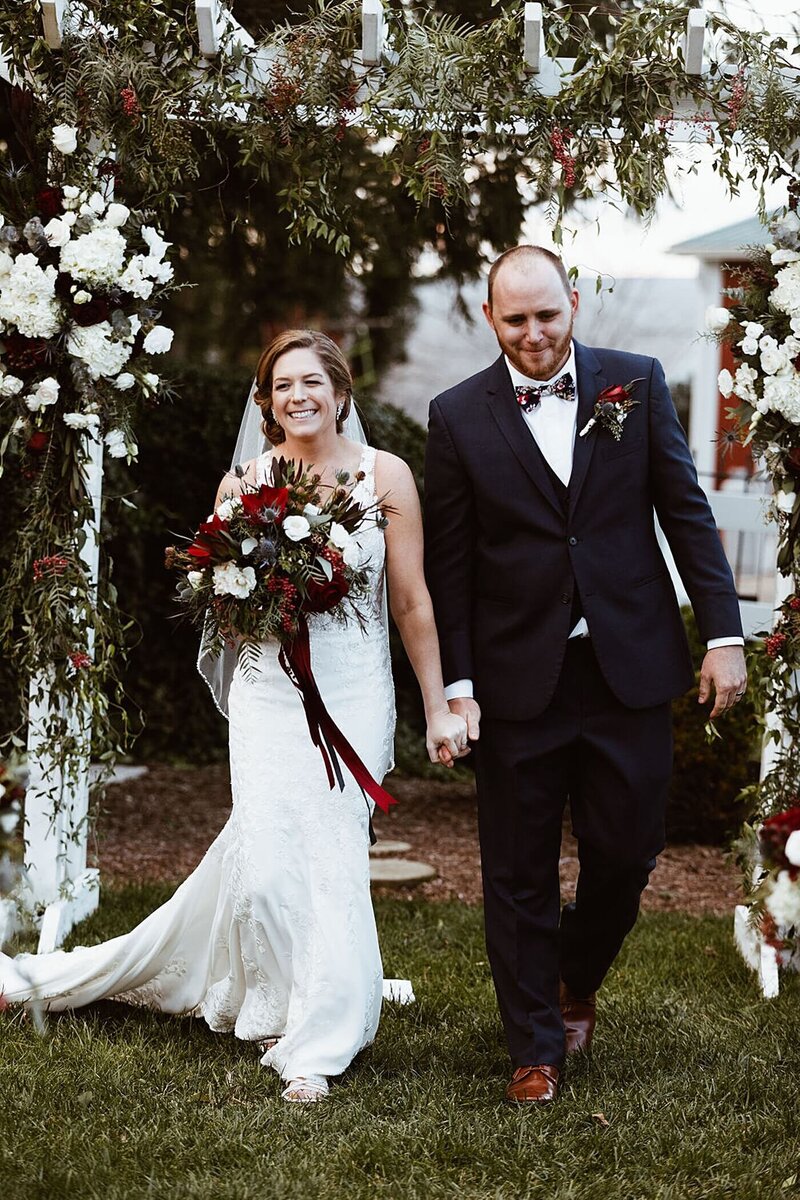 Bride and groom walk up memorial steps at their DC wedding