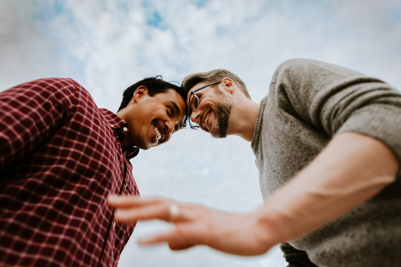 couple laughing together during engagement