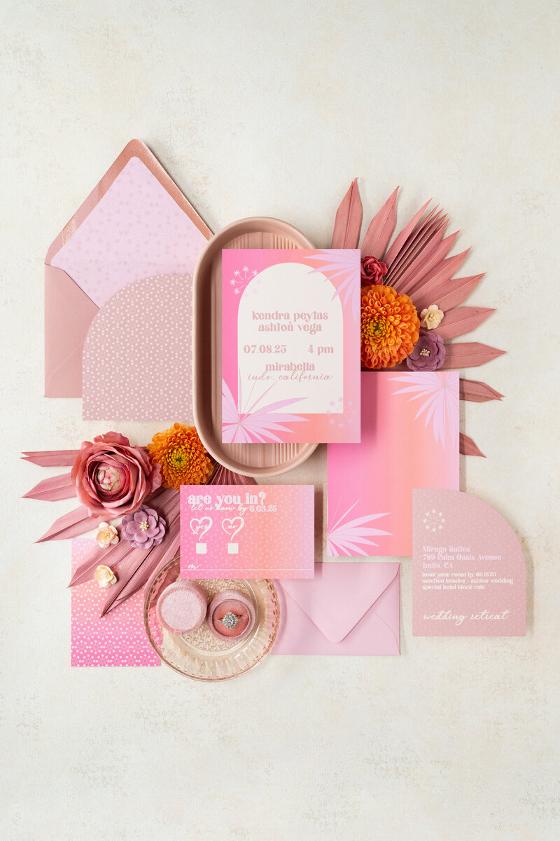 A retro themed wedding invitation suite with record place cards.
