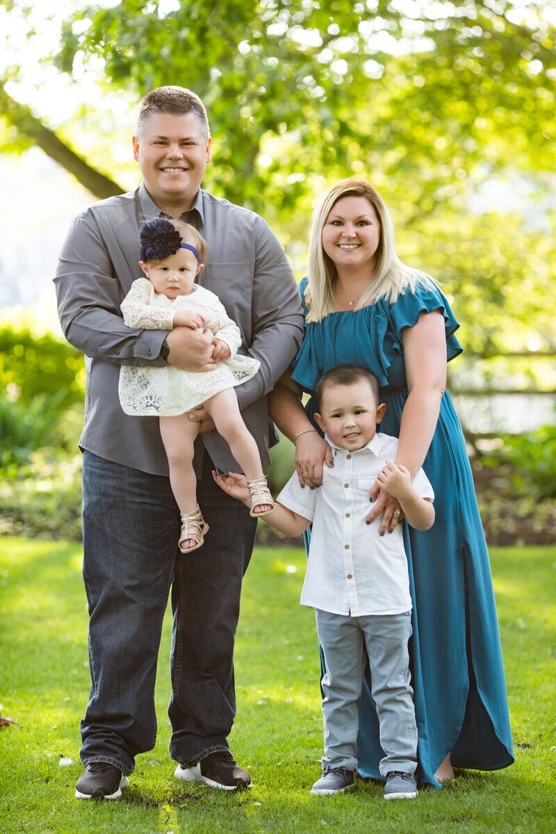 Family holding each other and looking at family photographers new jersey
