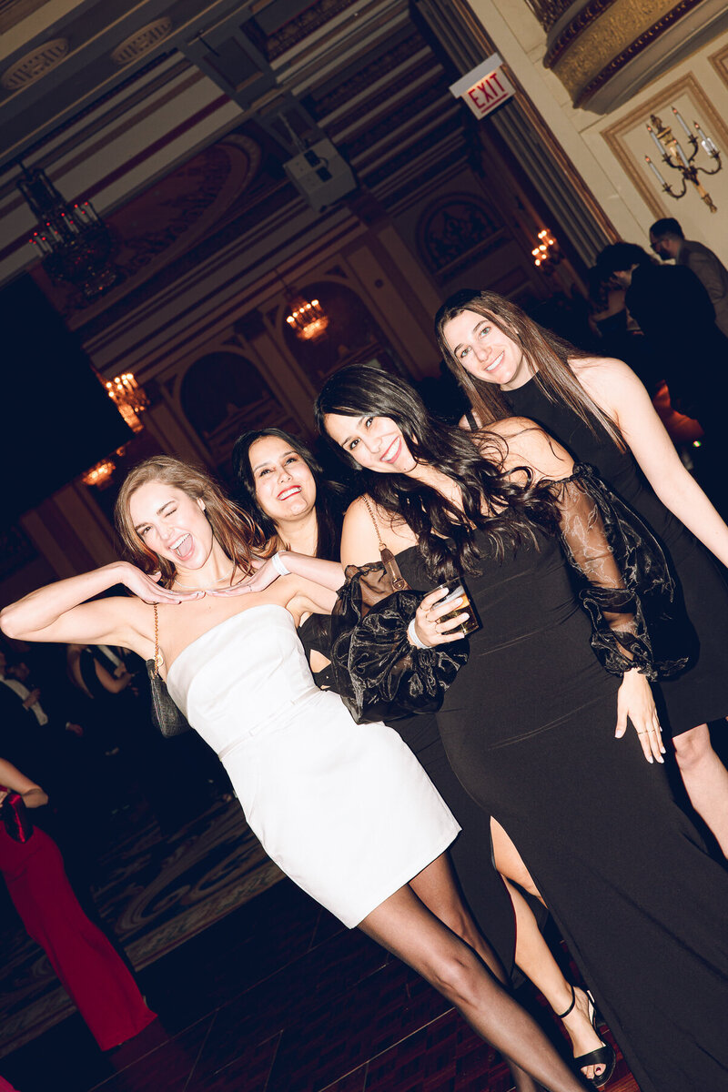 A group of friends pose during the Snowball Gala at the Palmer House hotel in Chicago