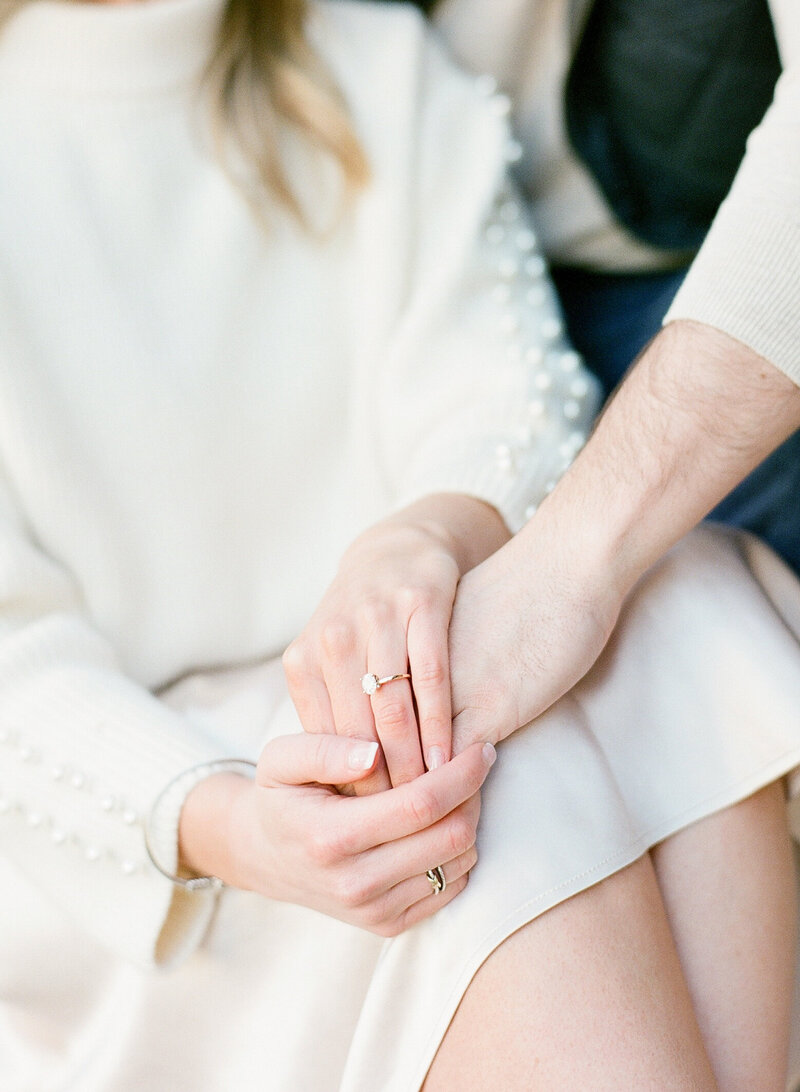 bride and groom take engagement photos in Charleston, bride in white dress, holding hands