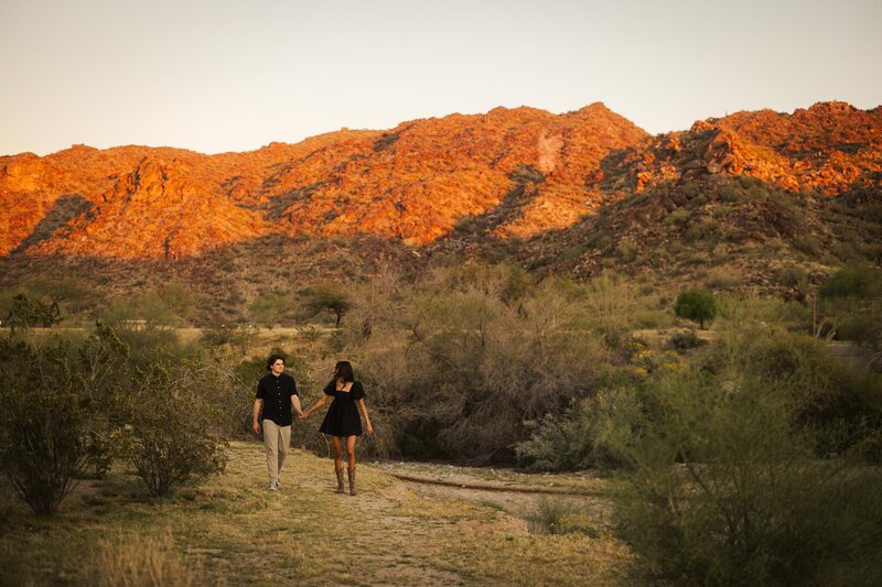 Colorful landscape with a couple in Arizona's foothills, showcasing natural beauty and vibrant hues.