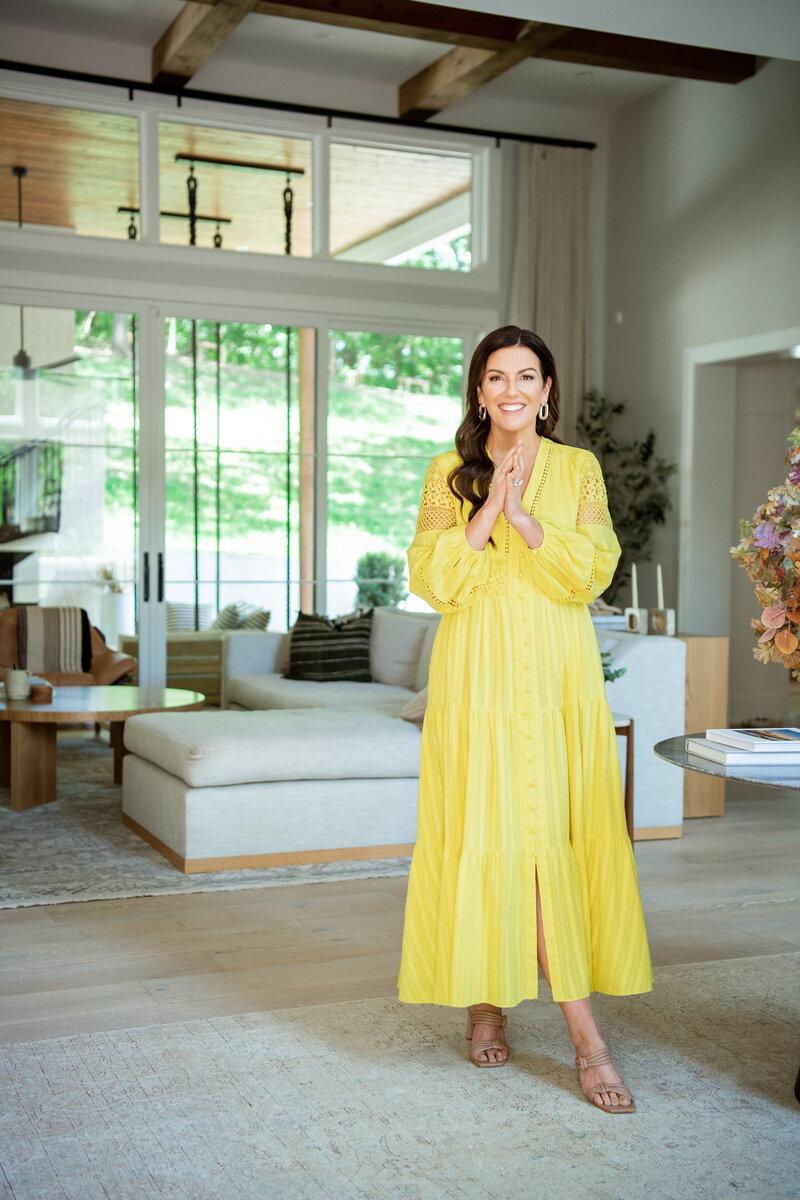 Amy in yellow dress in living room - Online Marketing Expert