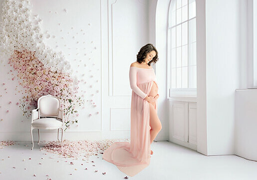 Green maternity gown on a pregnant woman in a Dublin studio.