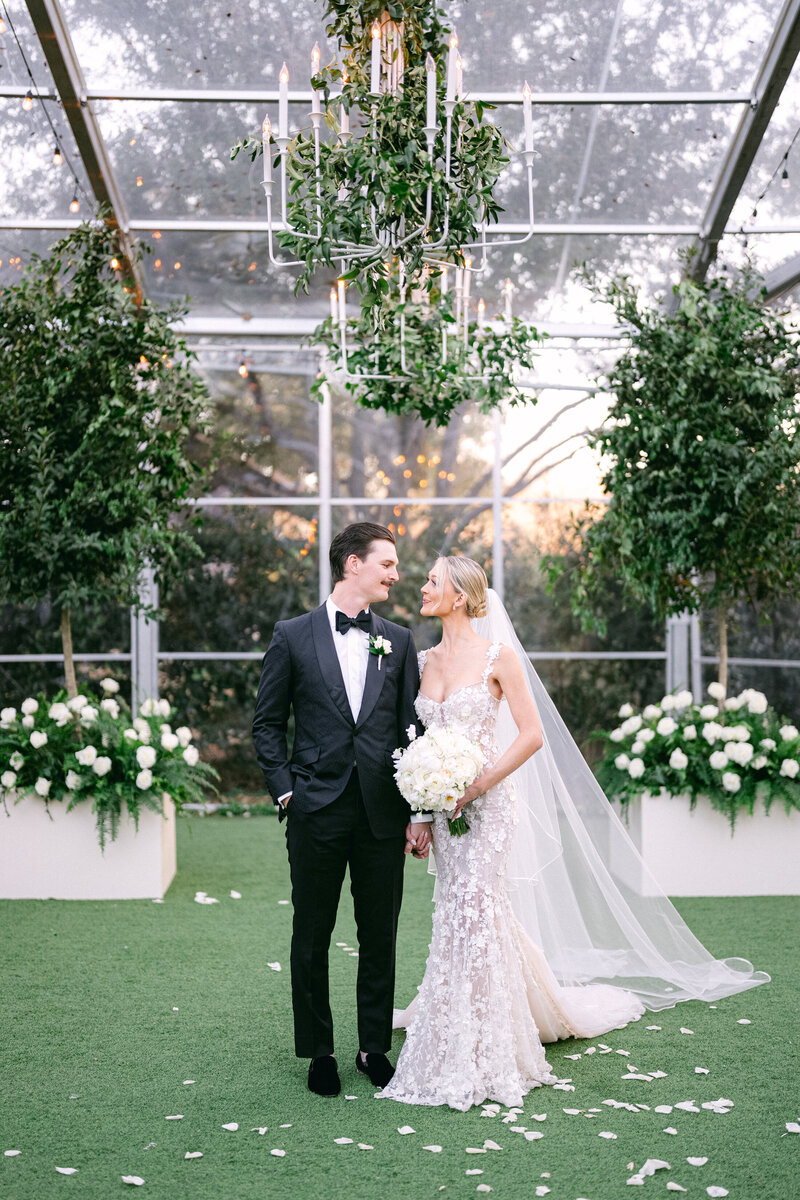 Tented wedding ceremony at Hotel Drover, with all white and green flowers and luxury details