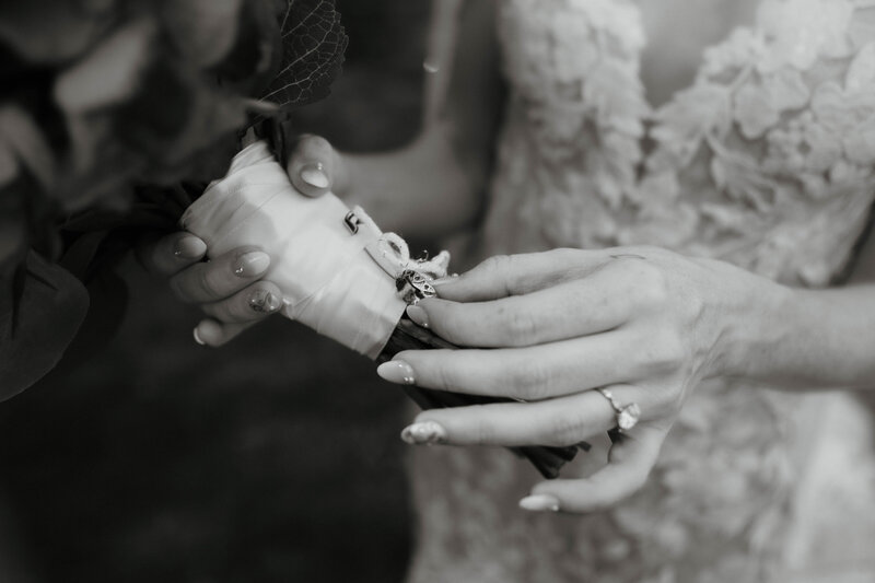 bride with wedding and engagement ring wedding photography holding bridal bouquet of wedding flowers at the tannery barn wedding venue in taneytown maryland