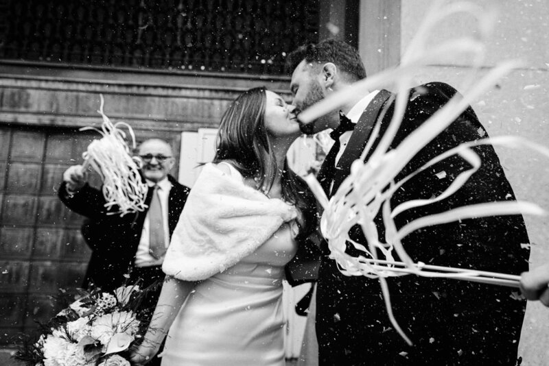 A couple take stress-free and fun photos outside of NYC City Hall.