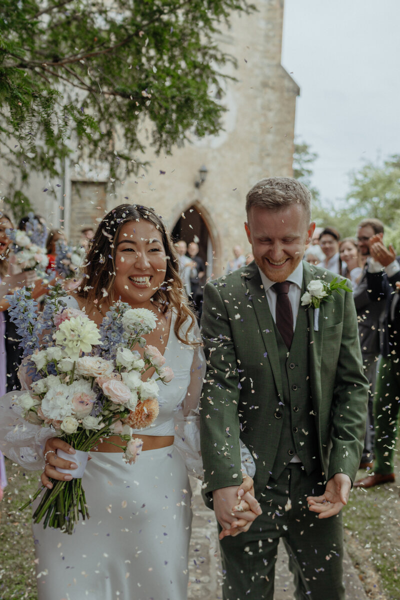confetti shot of Bride and groom at london wedding
