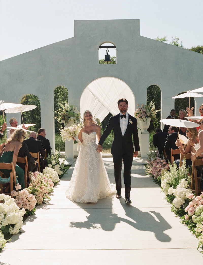 Couple saying their vows at their backyard wedding in California