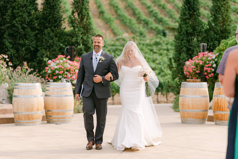Portrait of bride and groom in the vineyard at Tsillan Cellars winery in Chelan, WA