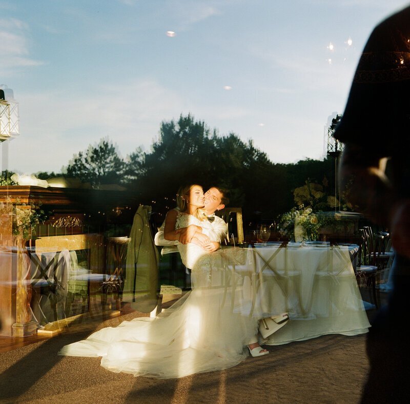 bride and groom kissing by wedding film photographer Noble Photo Co