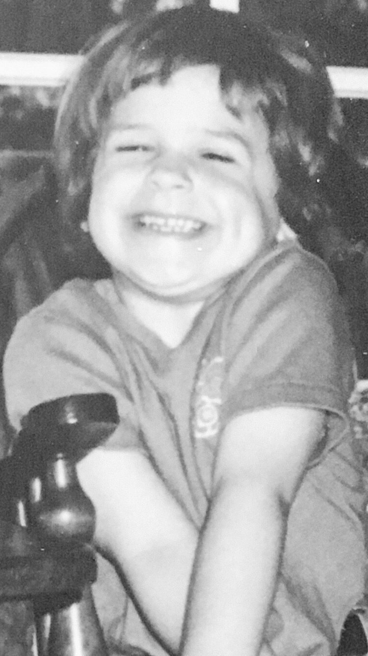early 90s photo of a young girl with a bowl cut