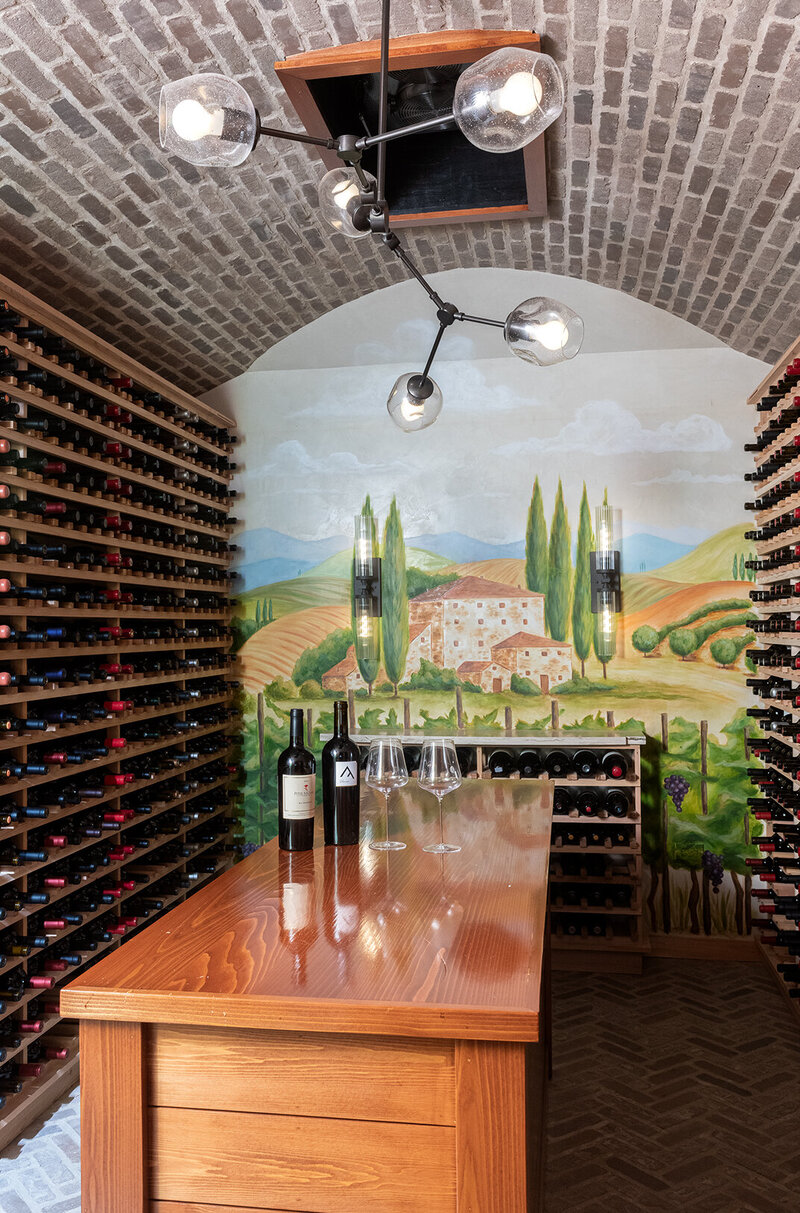 tan wood wine cellar with island top