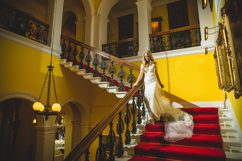 bride on the stairs at capesthorne hall