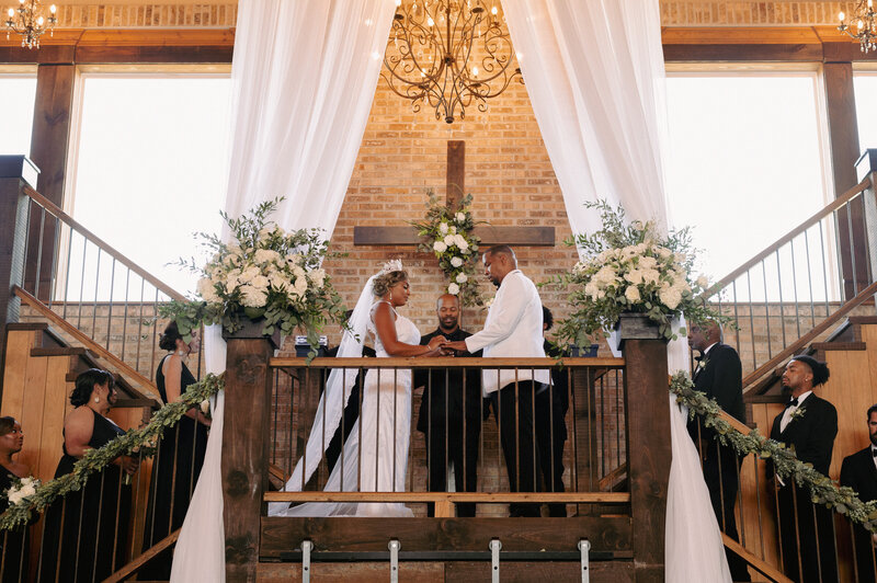 A bride and groom have a dance outside of their churh
