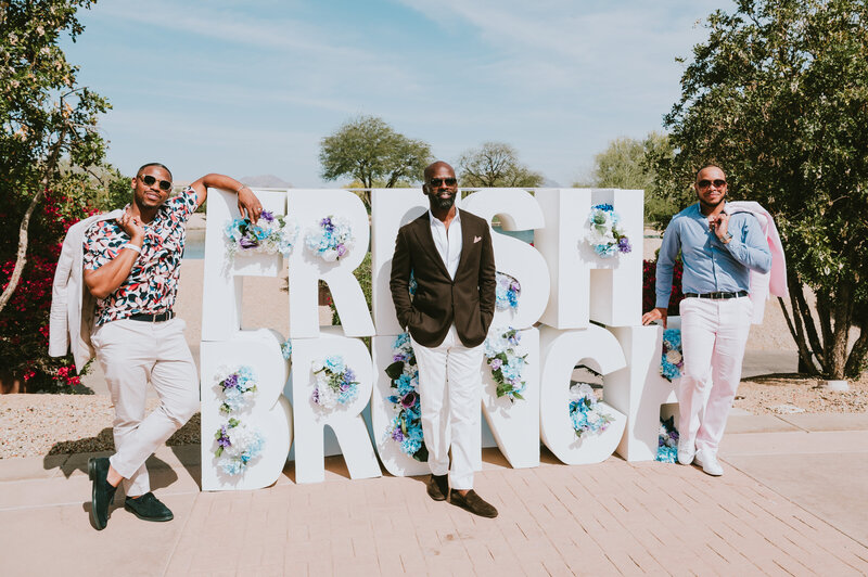 Men dressed in sharp attire posing in front of “Fresh Brunch” 3D letters—captured by MISGIF at a bold, branded Phoenix corporate event.
