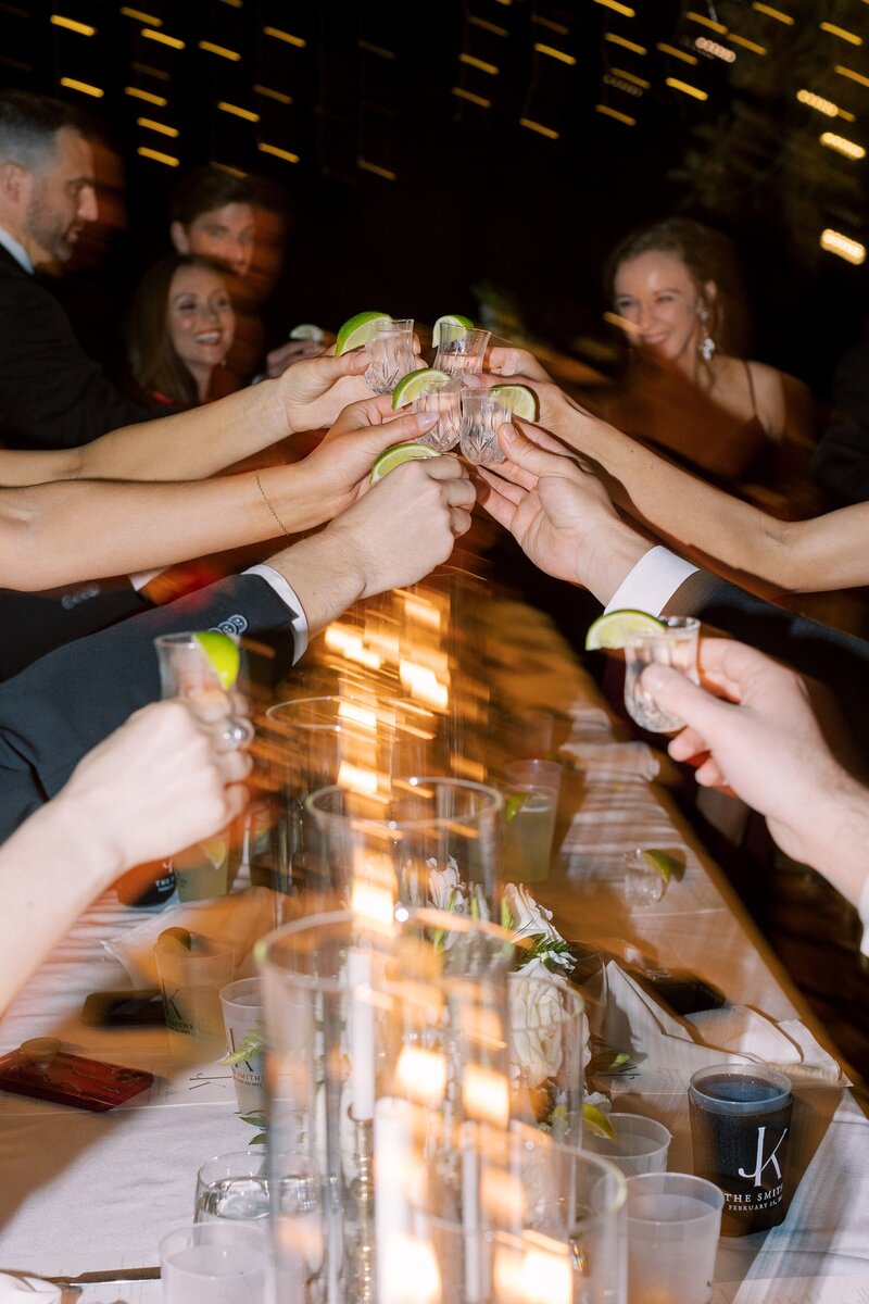 wedding-guests-clink-glasses-595
